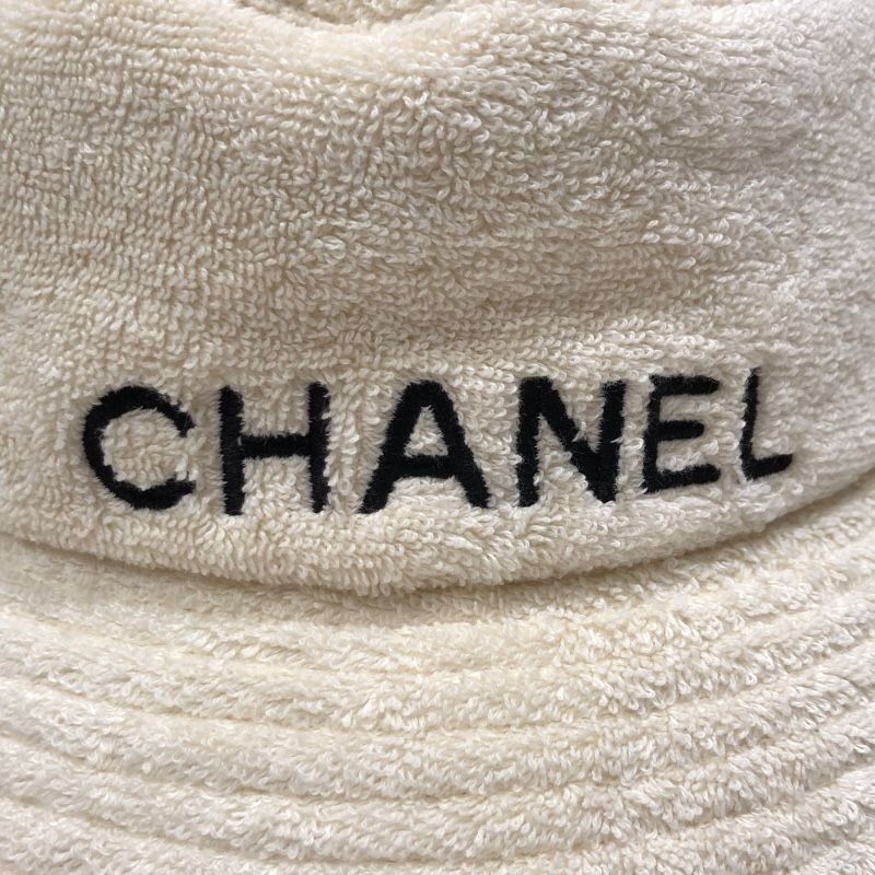 CHANEL Logo Embroidered Pile Bucket Hat in Cream Cotton
