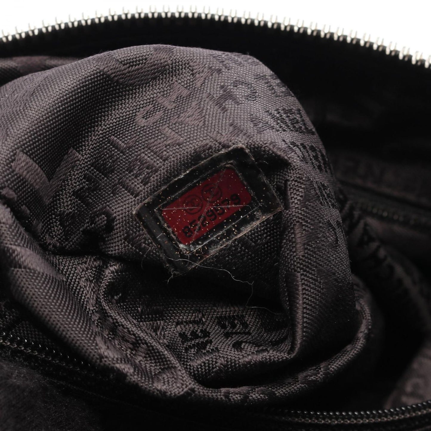 CHANEL Black Calfskin Logo Handbag with Fringe - Timeless Elegance