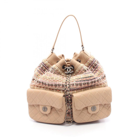 CHANEL Matelassé Coco Mark Backpack in Beige Lambskin