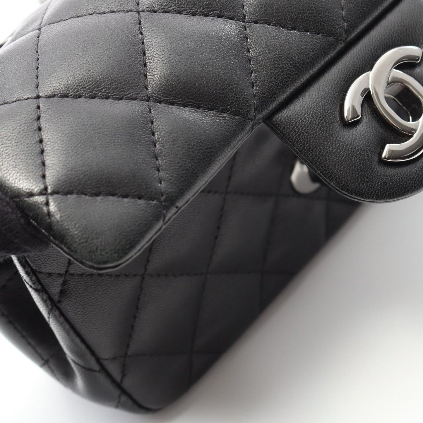 CHANEL Mini Matelassé Shoulder Bag in Black Lambskin