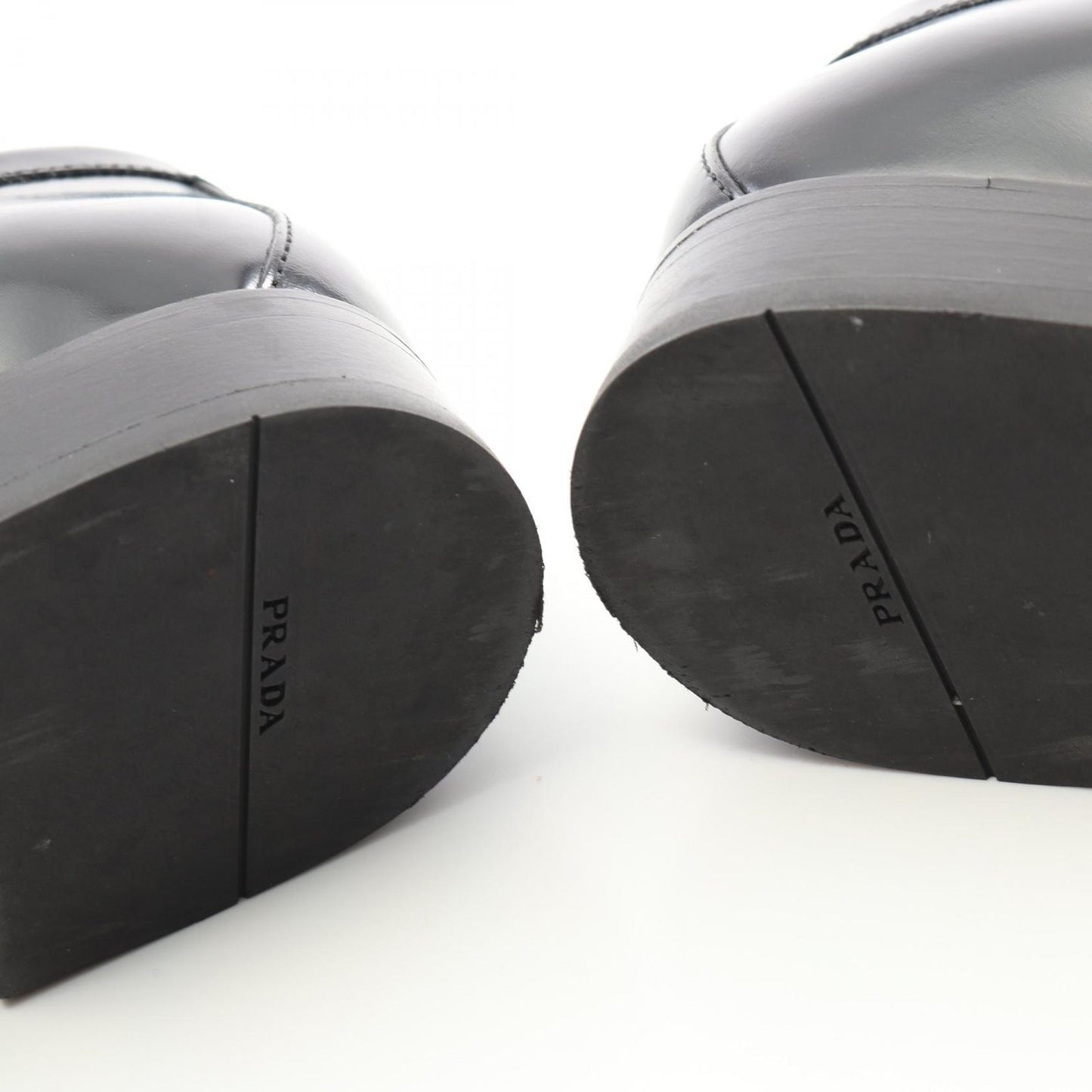 PRADA Triangle Logo Leather Loafers - Timeless Elegance