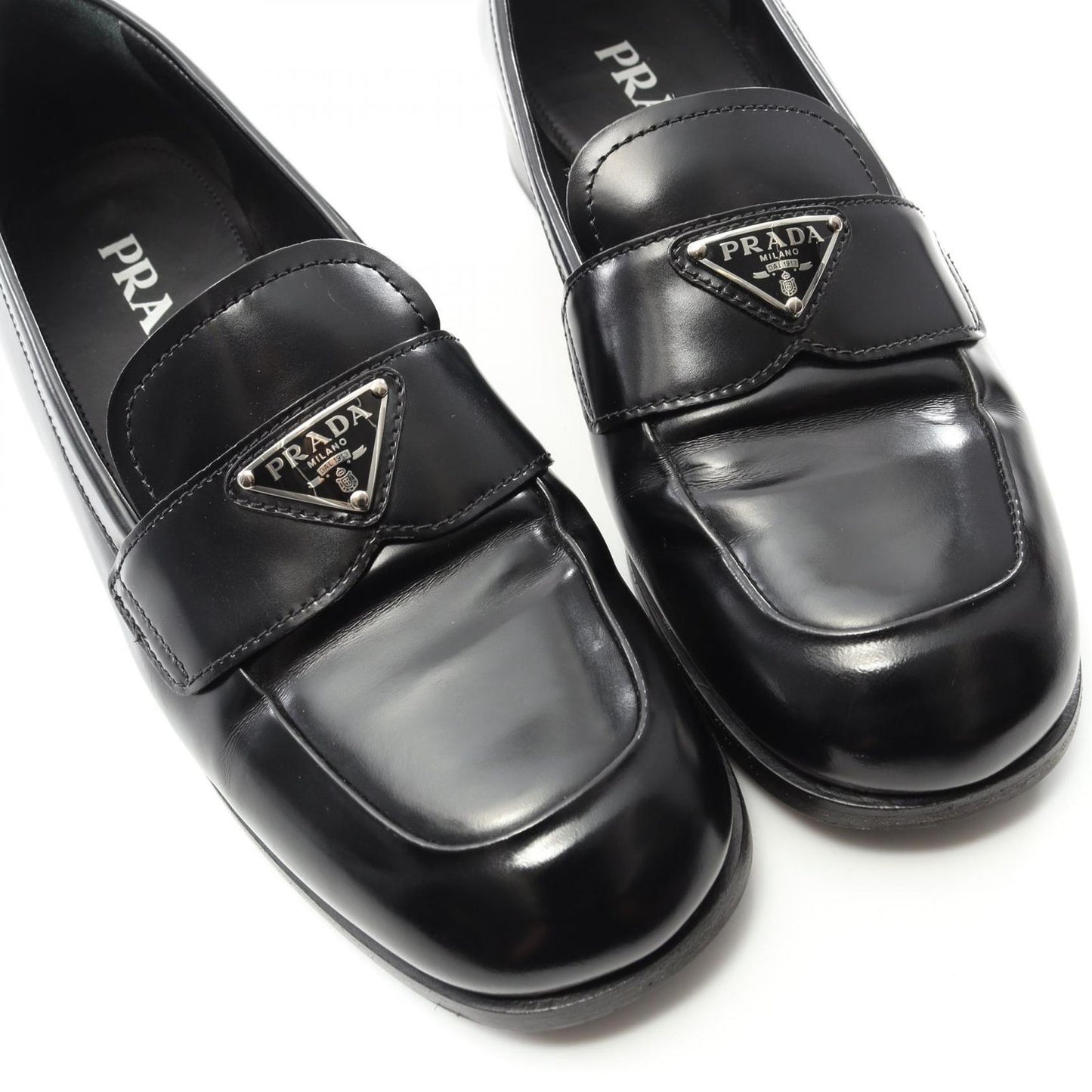 PRADA Triangle Logo Leather Loafers - Timeless Elegance