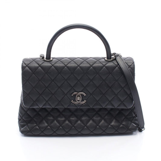 CHANEL Matelassé Coco Handle Handbag in Black Caviar Leather